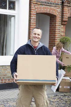 Removal team sorting recyclable packing materials during a sustainable move