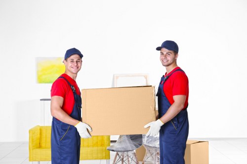 Professional house removalists packing boxes in a Teddington home