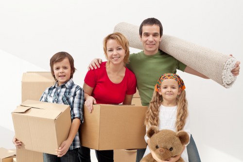 Careful loading of household items during flat removals in Teddington