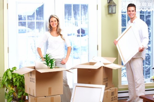 Professional movers loading furniture during a Teddington home move
